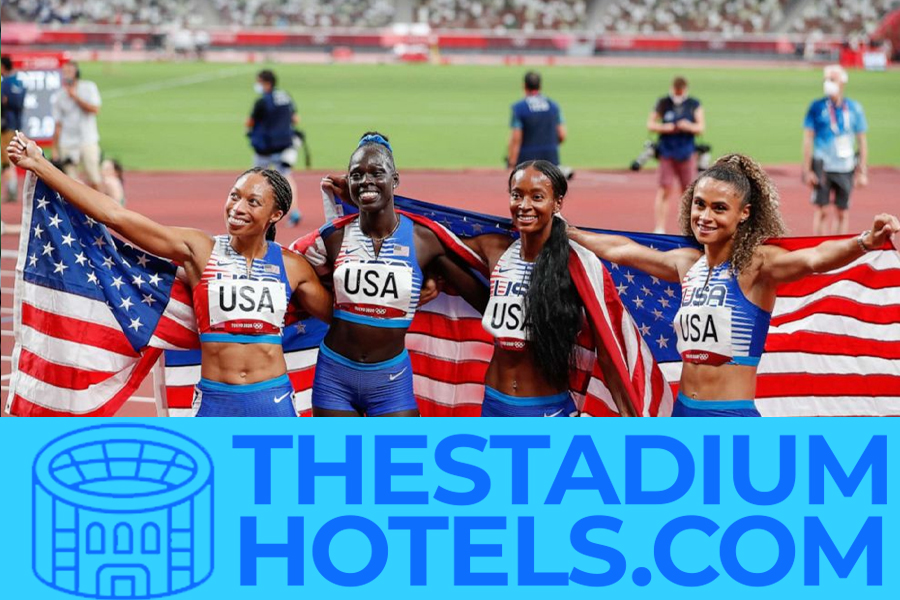 Olympic stadium and city skyline at sunset